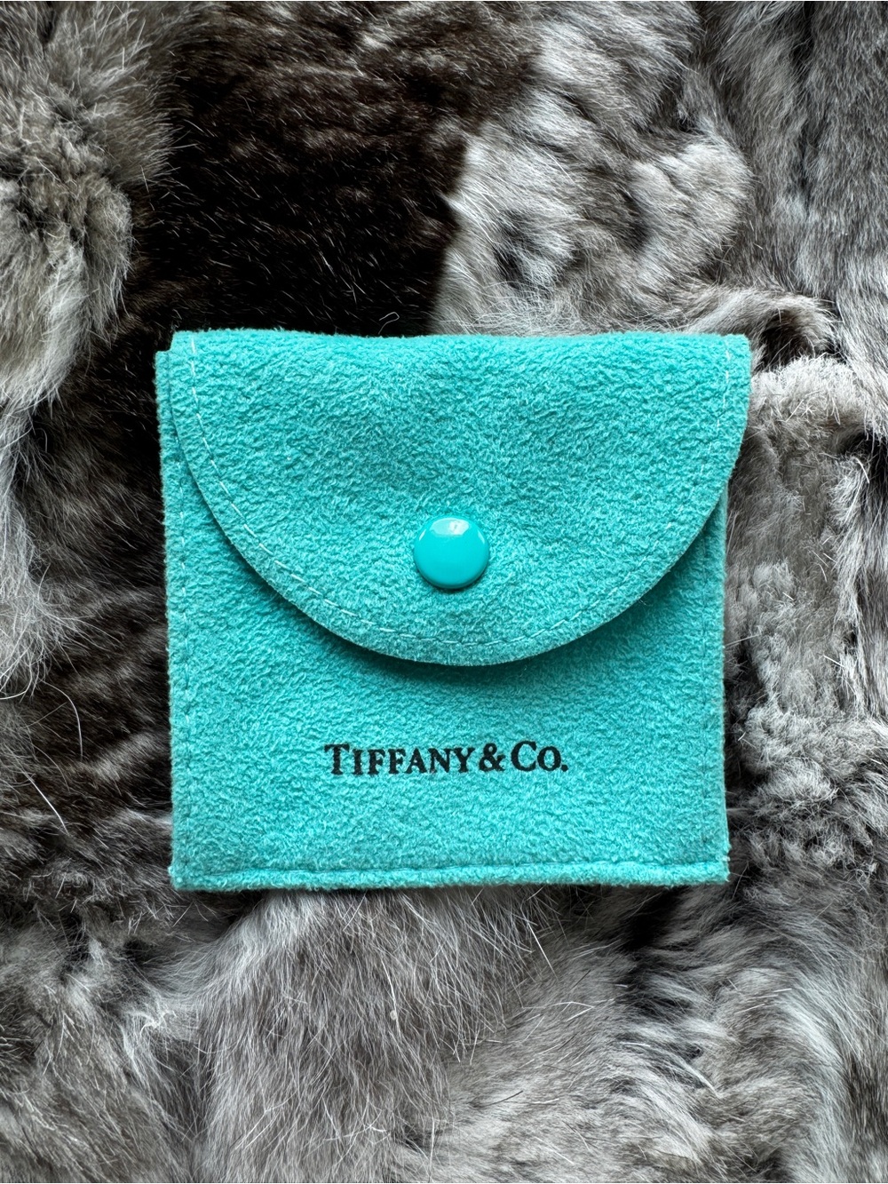 Tiffany & Co. turquoise suede jewelry pouch